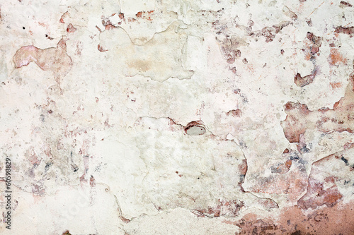 Old grunge wall with cracked stucco. Background texture