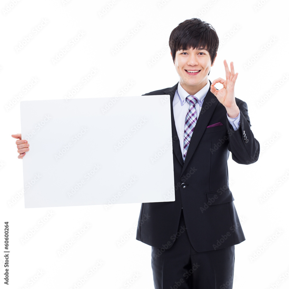 Young Asian business man holding a blank banner Young Asian business man holding a blank banner
