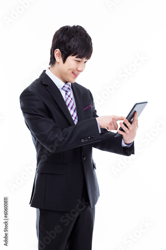 Young Asian business man using a pad PC