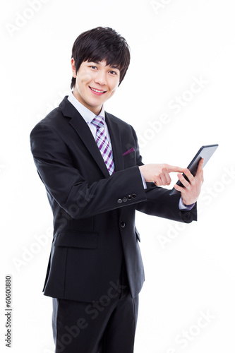 Young Asian business man using a pad PC