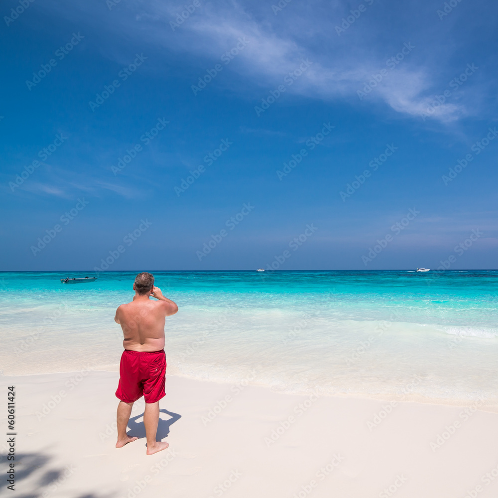 Man photographing sea scape at Tachai island
