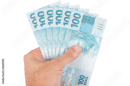 male hand holding brazilian six hundred reais, brazil money