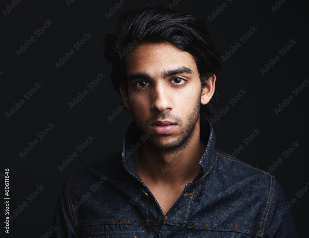 Obraz premium Portrait of a young man with denim jeans jacket