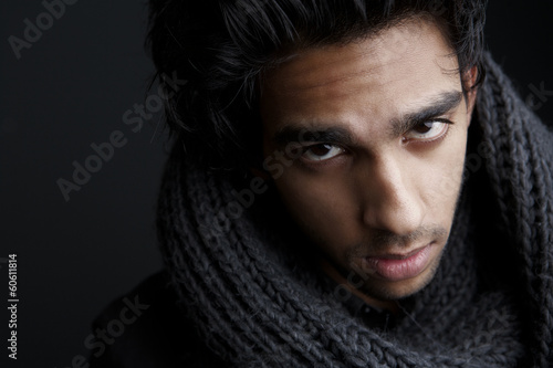 Portrait of a young man with gray wool scarf