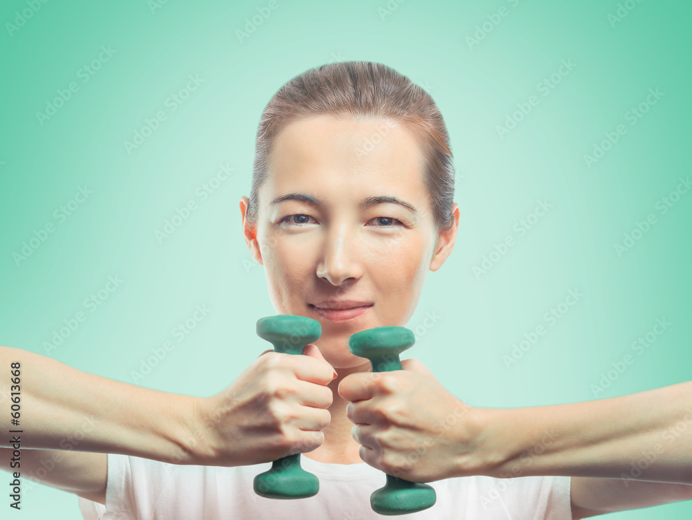 Happy woman holds two dumbbells Happy woman holds two dumbbells
