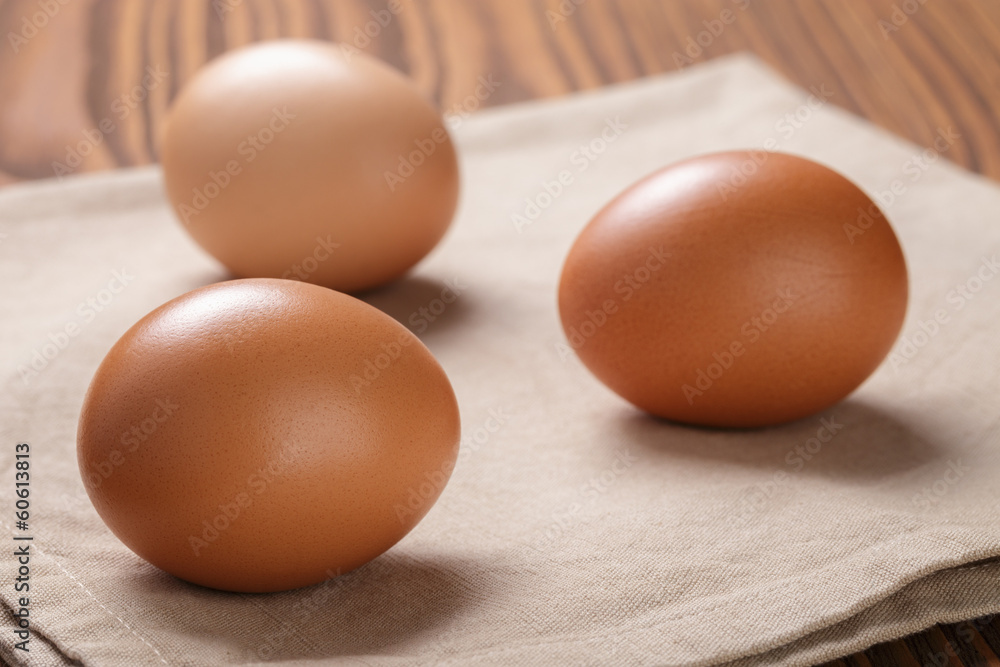 brown eggs on napkin over table brown eggs on napkin over table