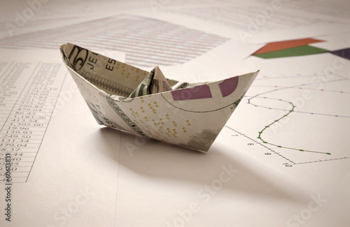 Dollar paper boat on financ...