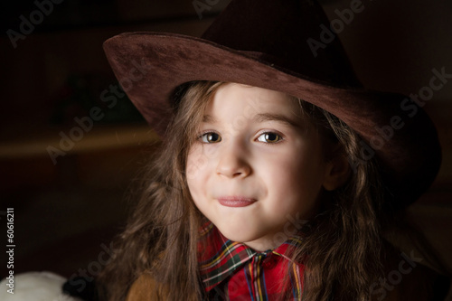 Young girl in a cowboy hat. Closeup
