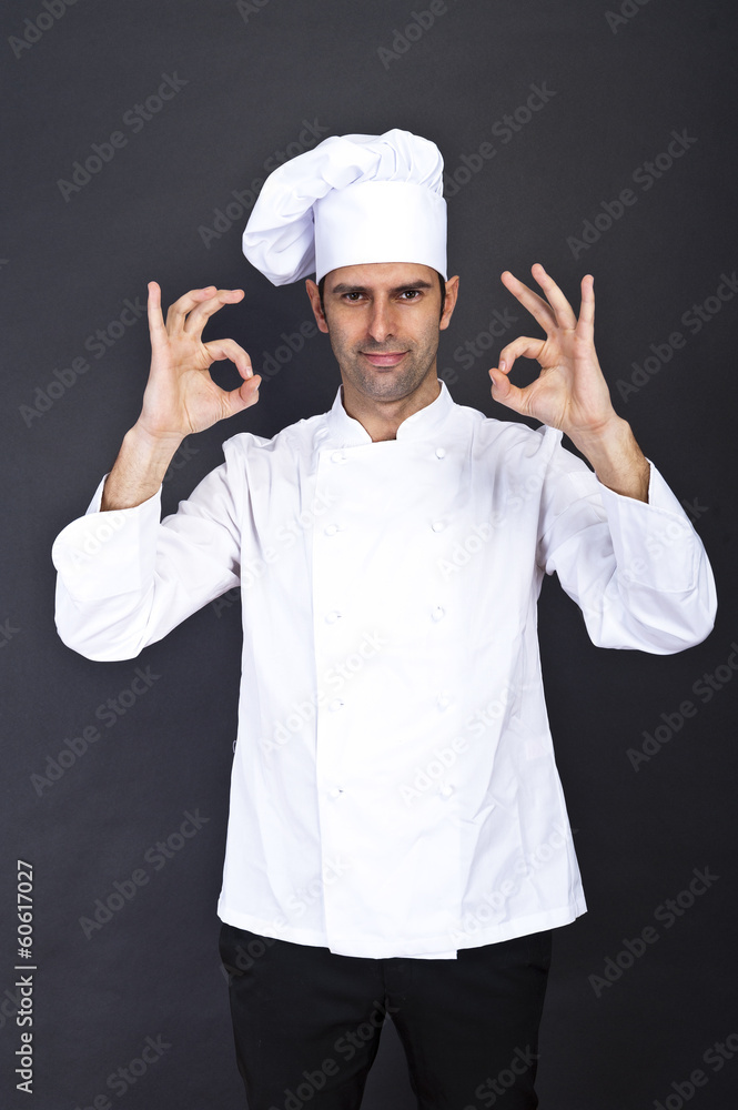 portriat of the cook over dark background portriat of the cook over dark background