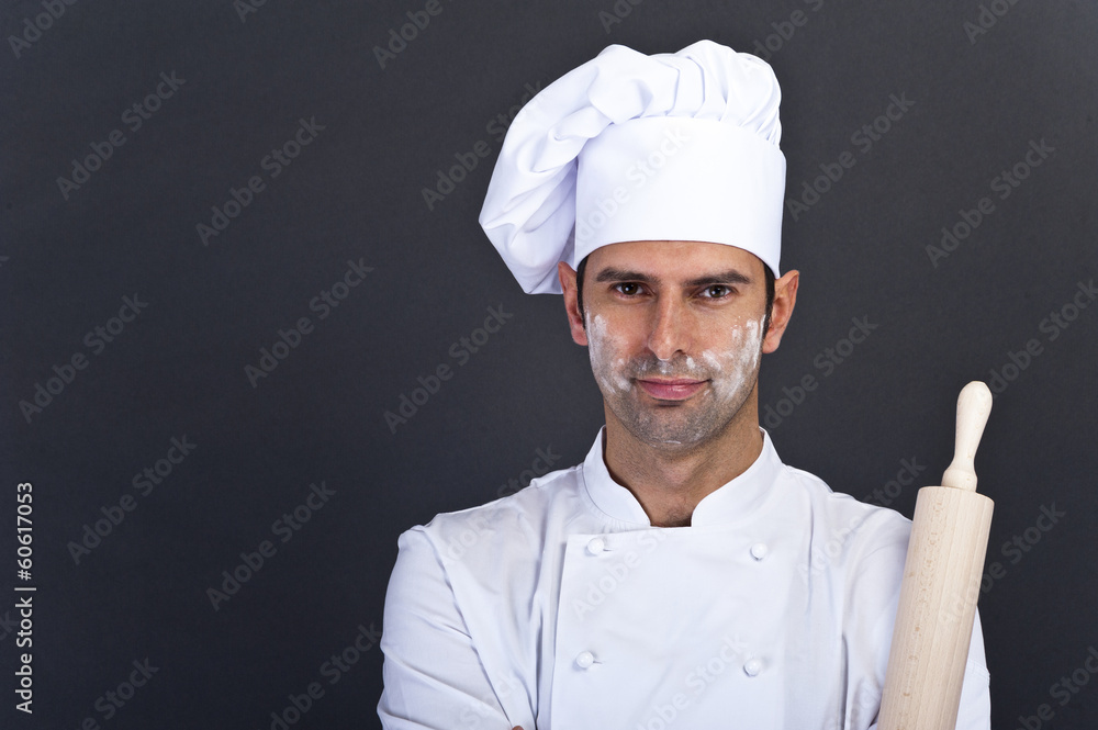 Male chef portrait against grey background Male chef portrait against grey background