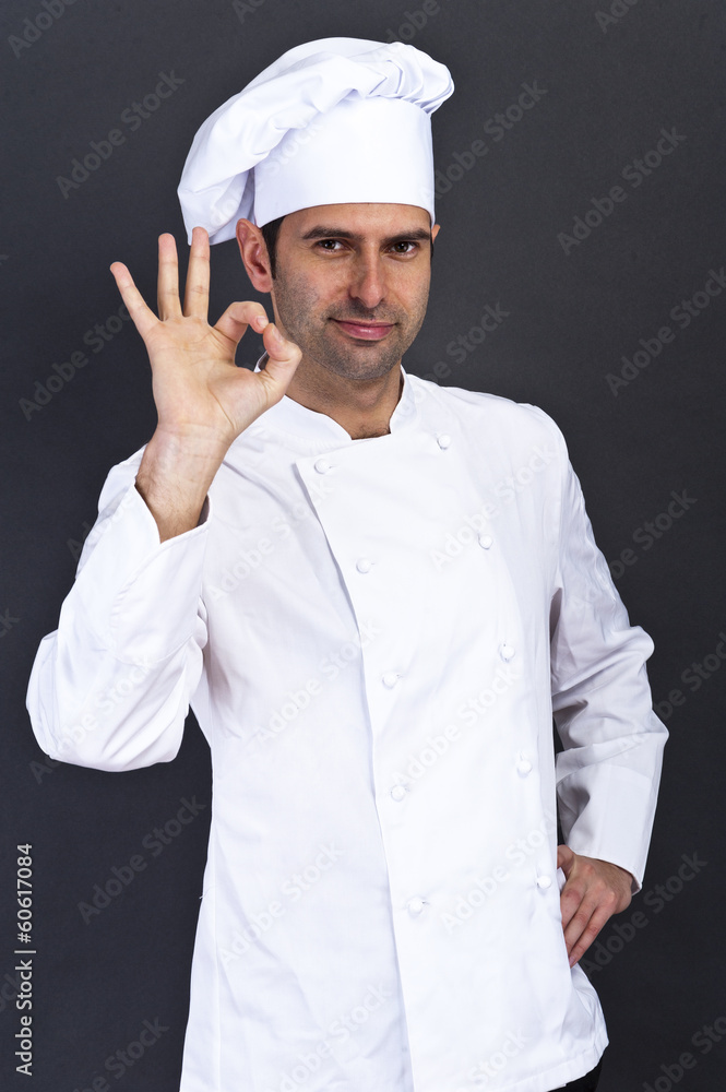 portriat of the cook over dark background portriat of the cook over dark background