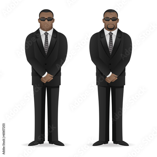 Black man bodyguard stands in closed pose