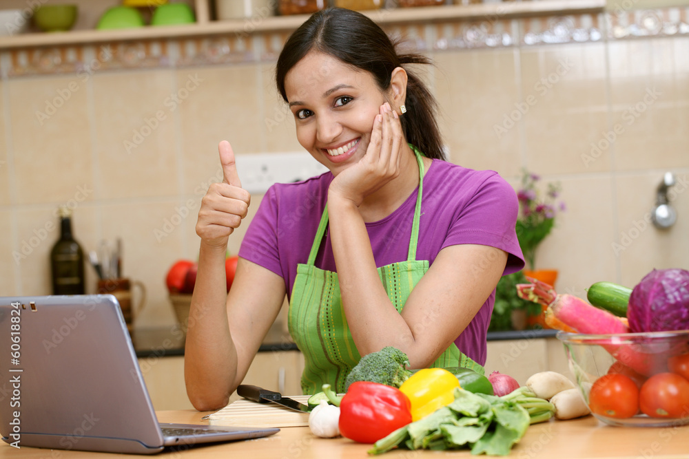 Young woman making thumbs up gesture Young woman making thumbs up gesture