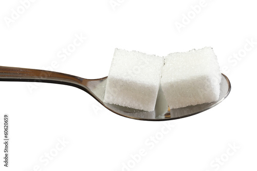 Würfelzucker auf Löffel