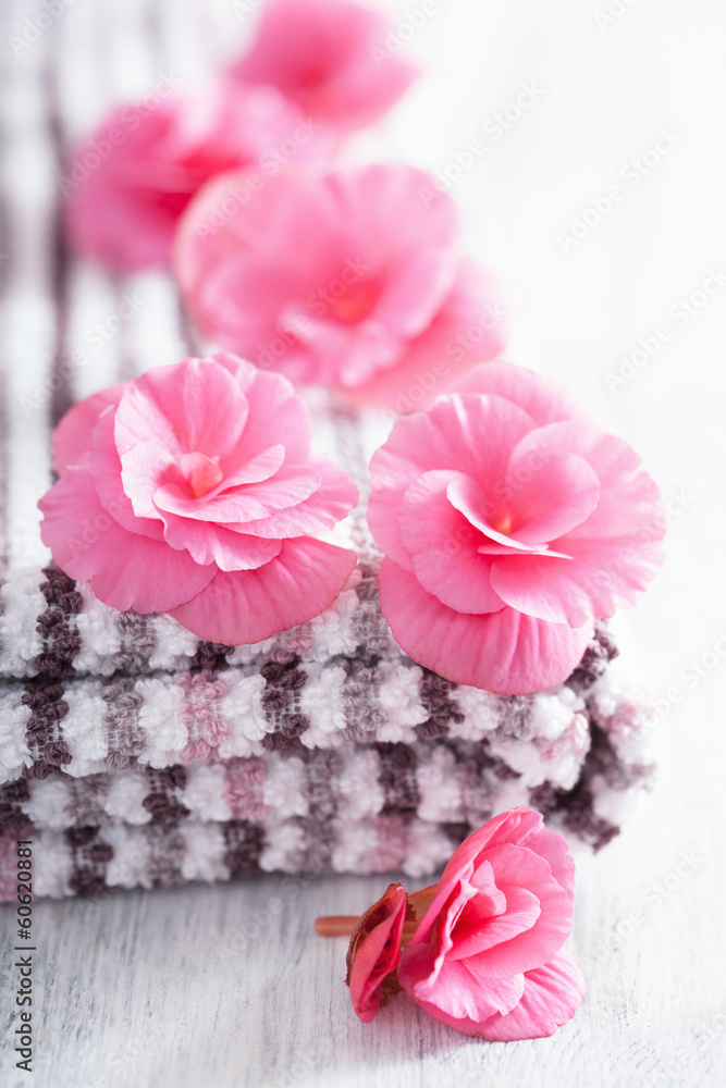 pink flowers and towel for spa pink flowers and towel for spa