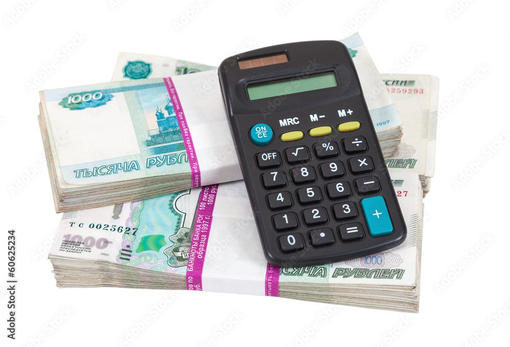 Business concepts. money with calculator on a white background Business concepts. money with calculator on a white background