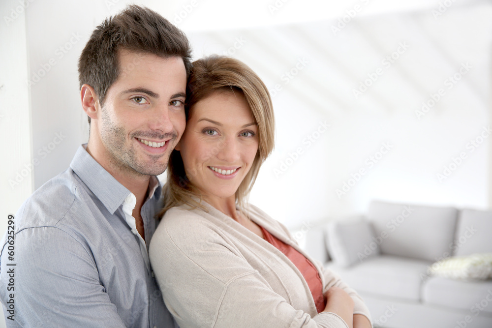 Couple standing in contemporary home