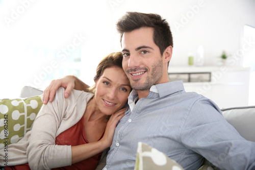 Sweet couple relaxing in sofa at home © goodluz