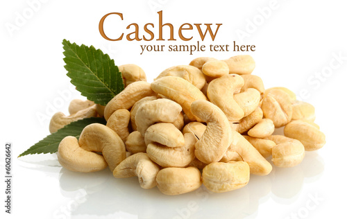 tasty cashew nuts with leaves, isolated on white