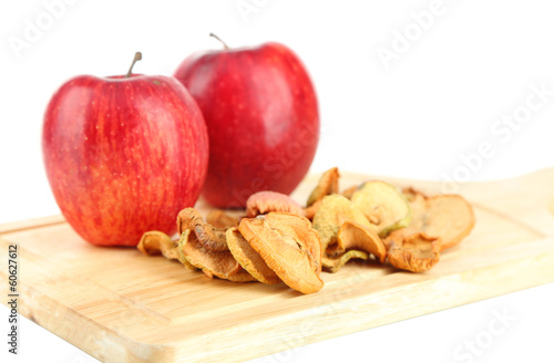 Dried apples and fresh apples,on cutting board isolated on