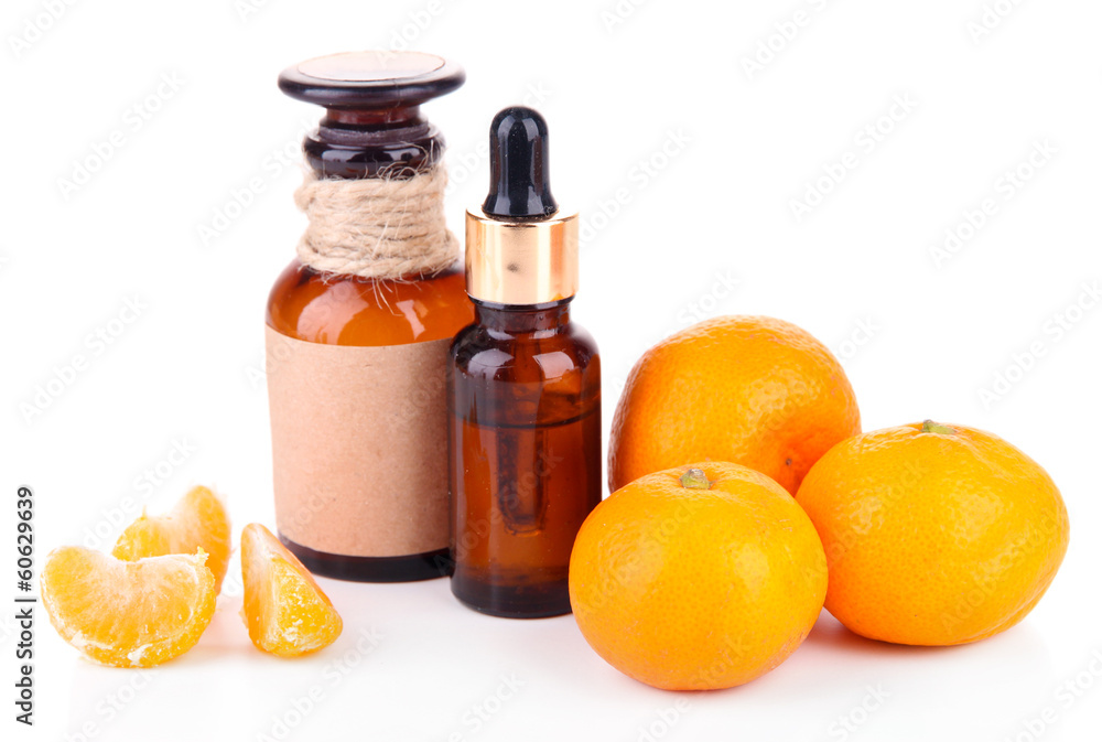 Tangerine essential oil and tangerines, isolated on white Tangerine essential oil and tangerines, isolated on white