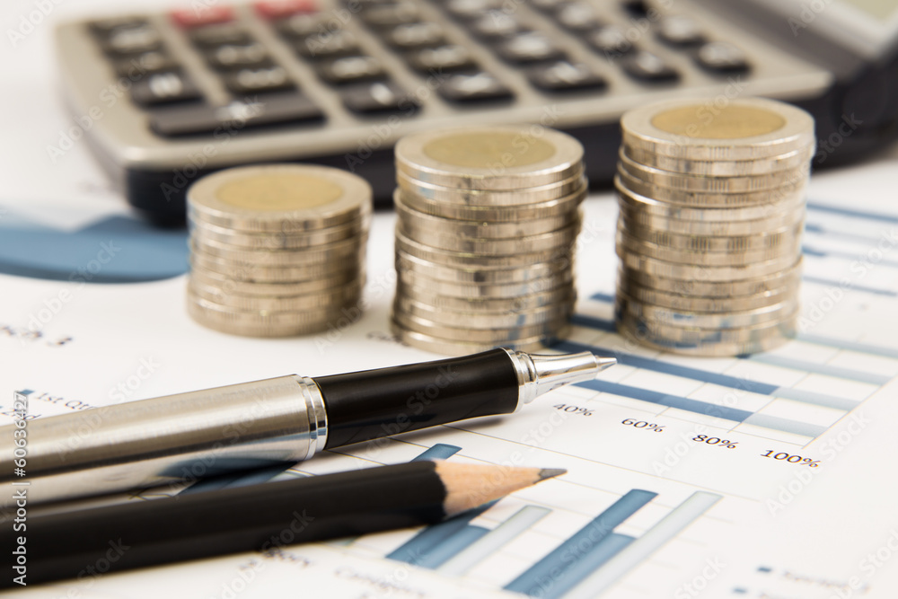 Business diagram on financial report with coins Business diagram on financial report with coins
