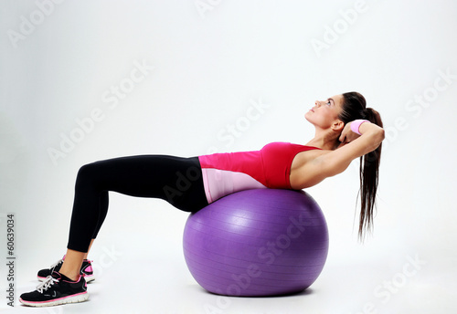 woman doing abs workout on fitball