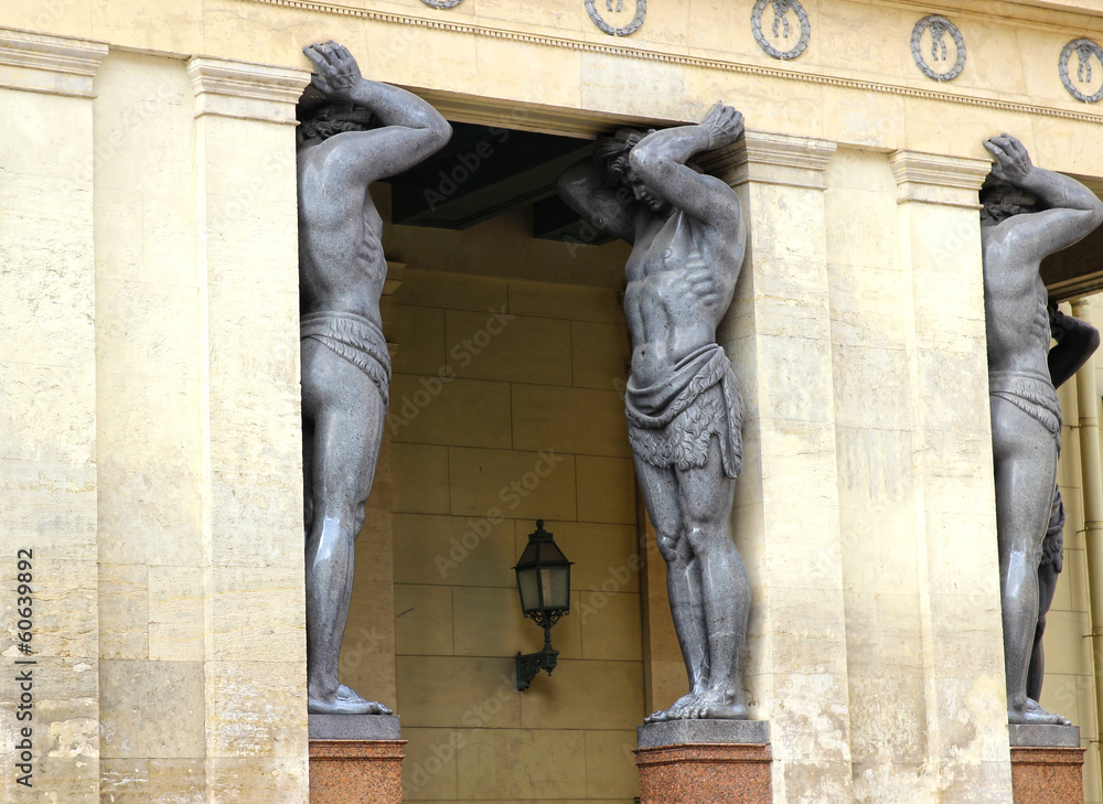 Fototapeta premium Marble Atlantes, holding the roof of the Hermitage