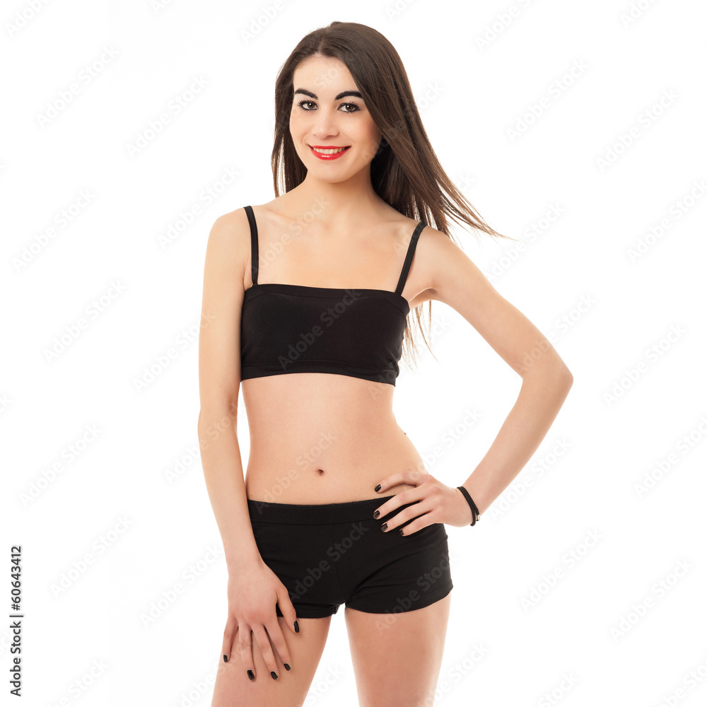 Sporty young woman portrait isolated against white background. Sporty young woman portrait isolated against white background.