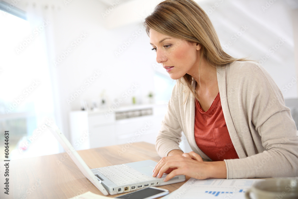 Businesswoman working from home in laptop computer Businesswoman working from home in laptop computer