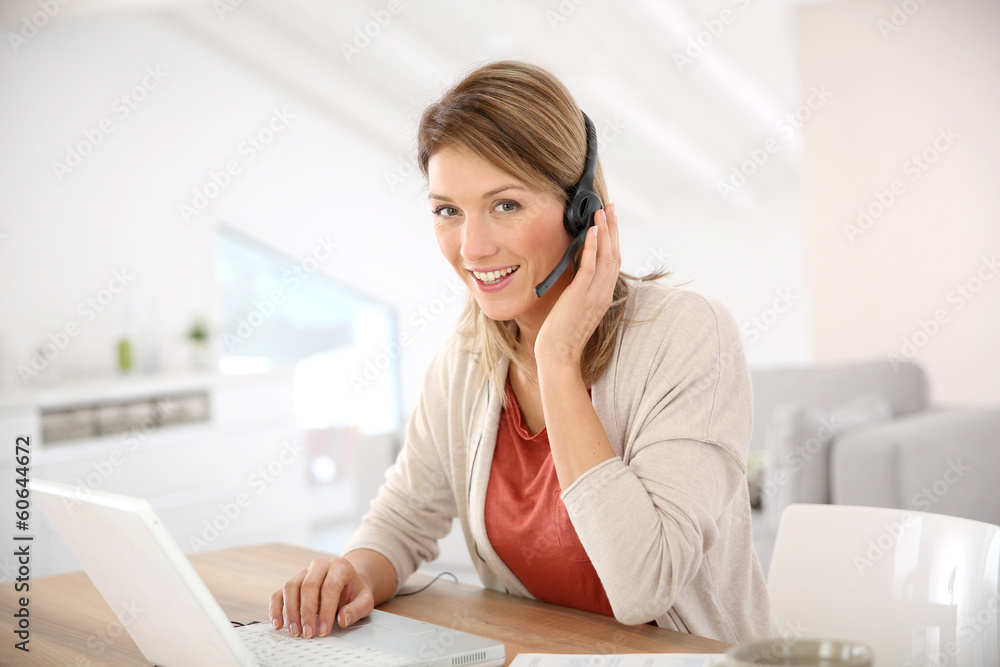 Businesswoman attending video conference from home Businesswoman attending video conference from home