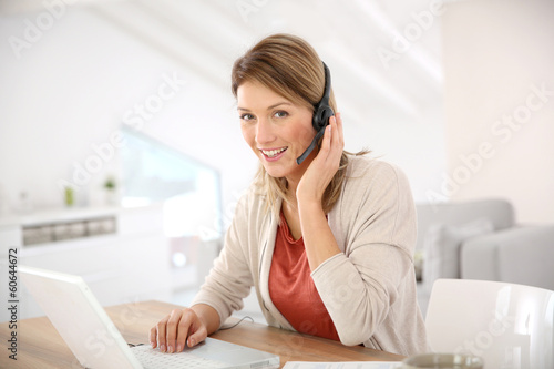 Businesswoman attending video conference from home