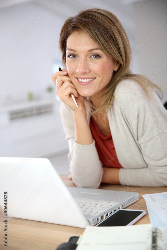 Businesswoman working from home in laptop computer Businesswoman working from home in laptop computer