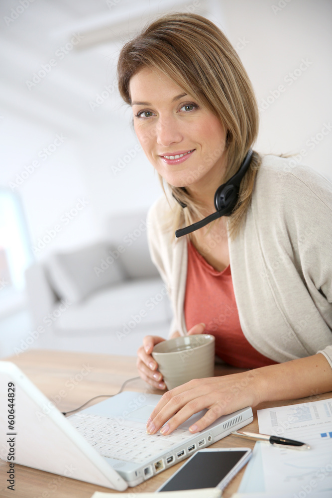 Businesswoman working from home in laptop computer Businesswoman working from home in laptop computer