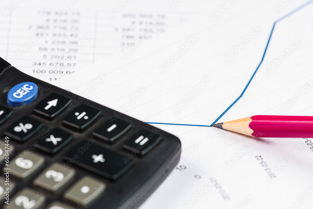 Businessman showing a diagram on a financial report using a pen Businessman showing a diagram on a financial report using a pen