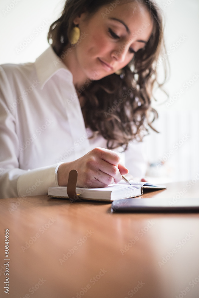 beautiful woman at home writing and working beautiful woman at home writing and working