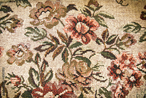 Fragment of retro tapestry fabric pattern with colorful floral
