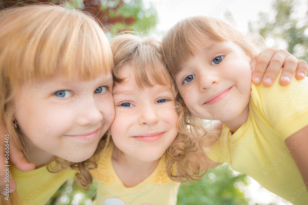 Fototapeta premium Low angle view portrait of happy children