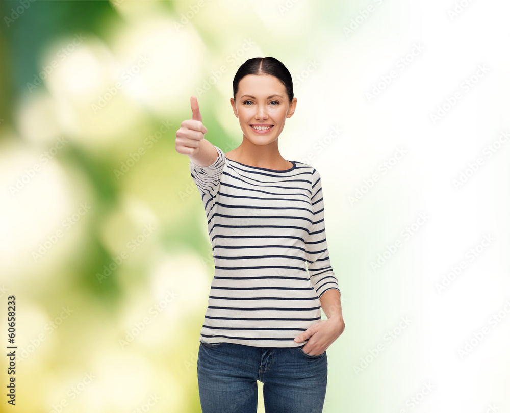 smiling girl in casual clother showing thumbs up smiling girl in casual clother showing thumbs up