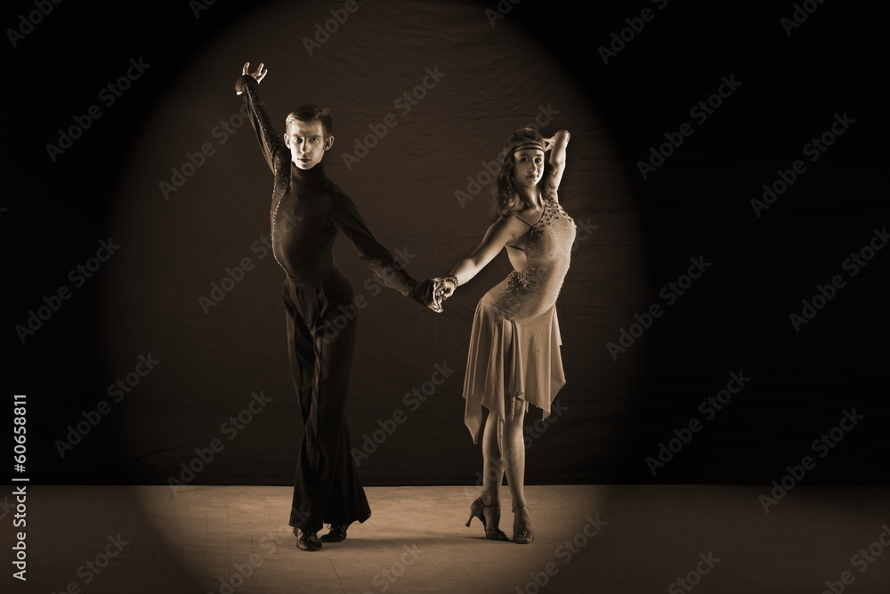 dancers in ballroom isolated on black background