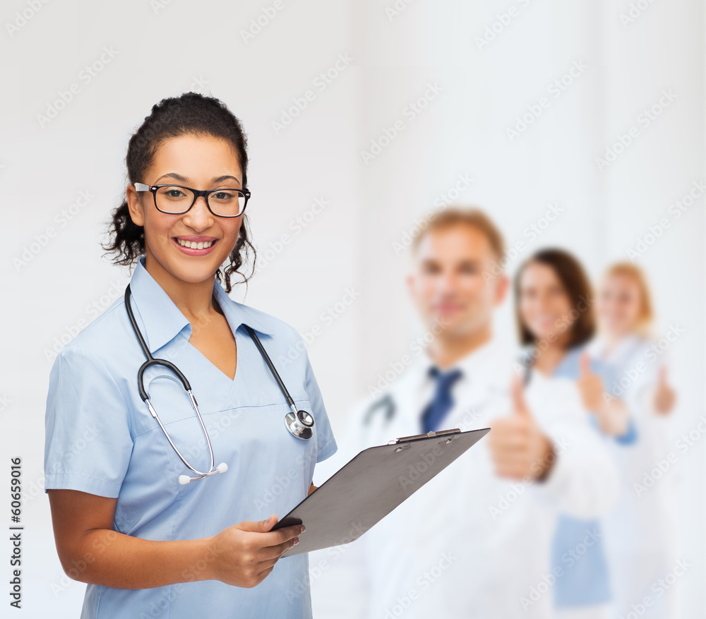 smiling female african american doctor or nurse smiling female african american doctor or nurse