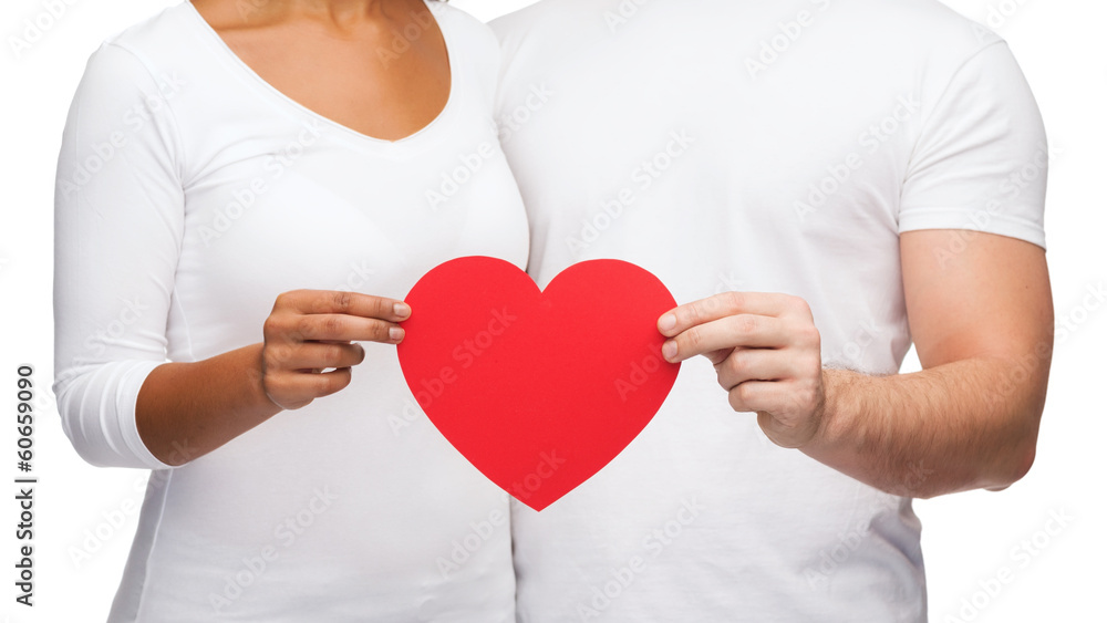 closeup of couple hands with heart closeup of couple hands with heart