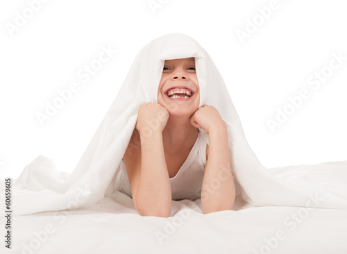 child in white bed