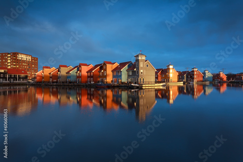 multicolor buildings on water in sunshine