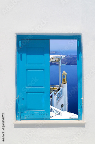Open traditional Greek blue window on Santorini island, Greece