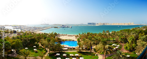 Panorama of beach with a view on Jumeirah Palm man-made island,