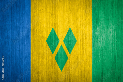 Saint Vincent and the Grenadines Flag on wood background