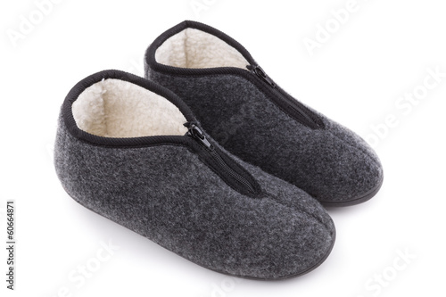 Homemade warm room slippers. On a white background.