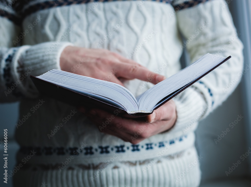 Man reading. Book in his hands. Man reading. Book in his hands.