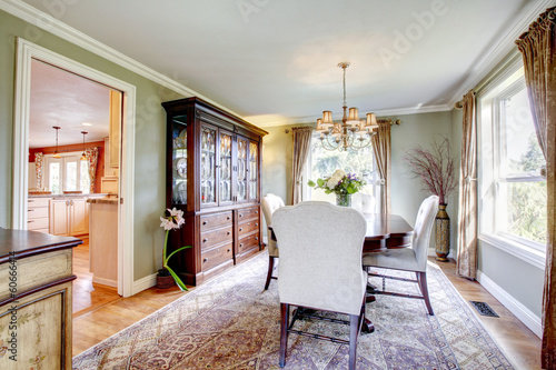 Olive and brown dining room with aristocratic furniture © Iriana Shiyan